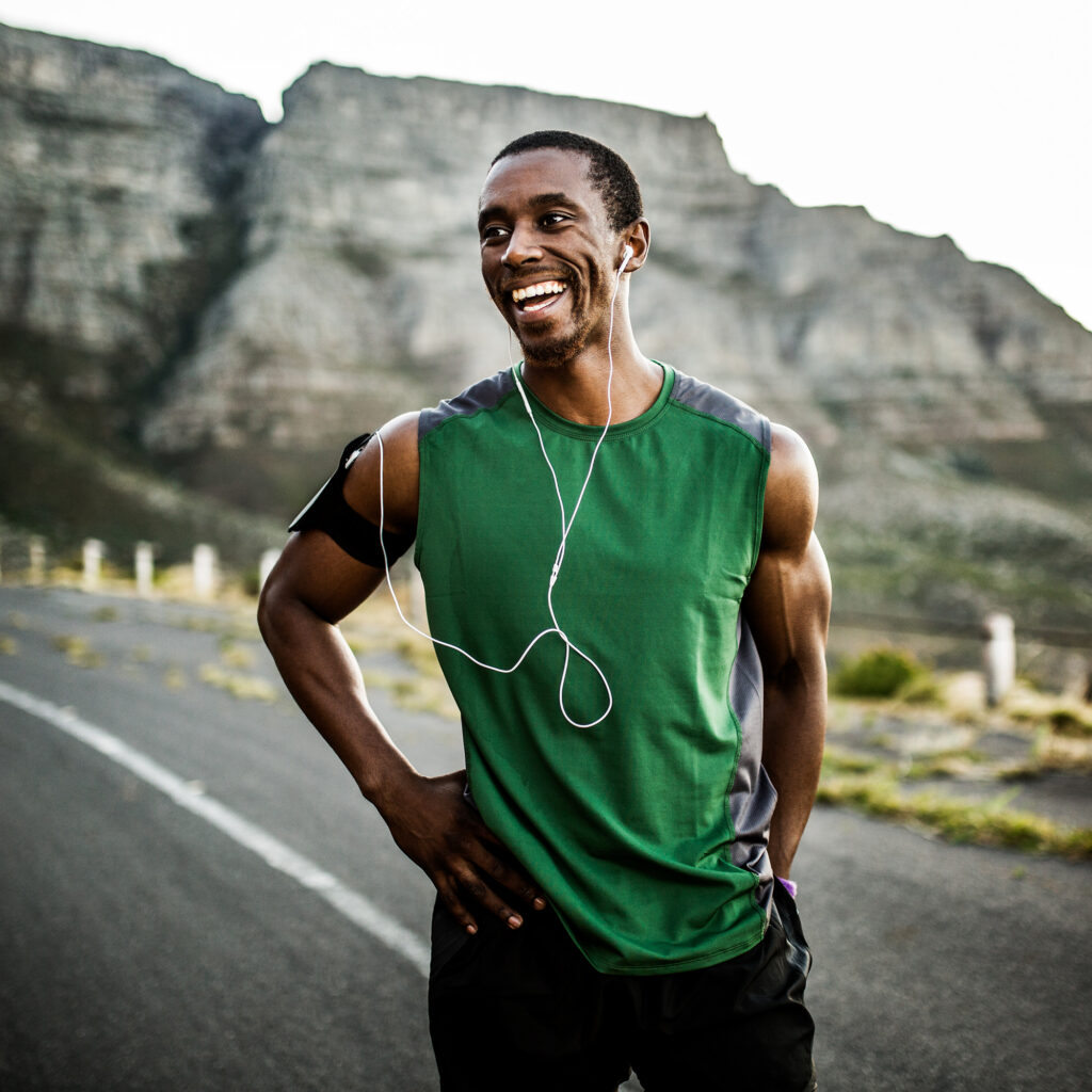 African athlete smiling positively after a good training session outdoors